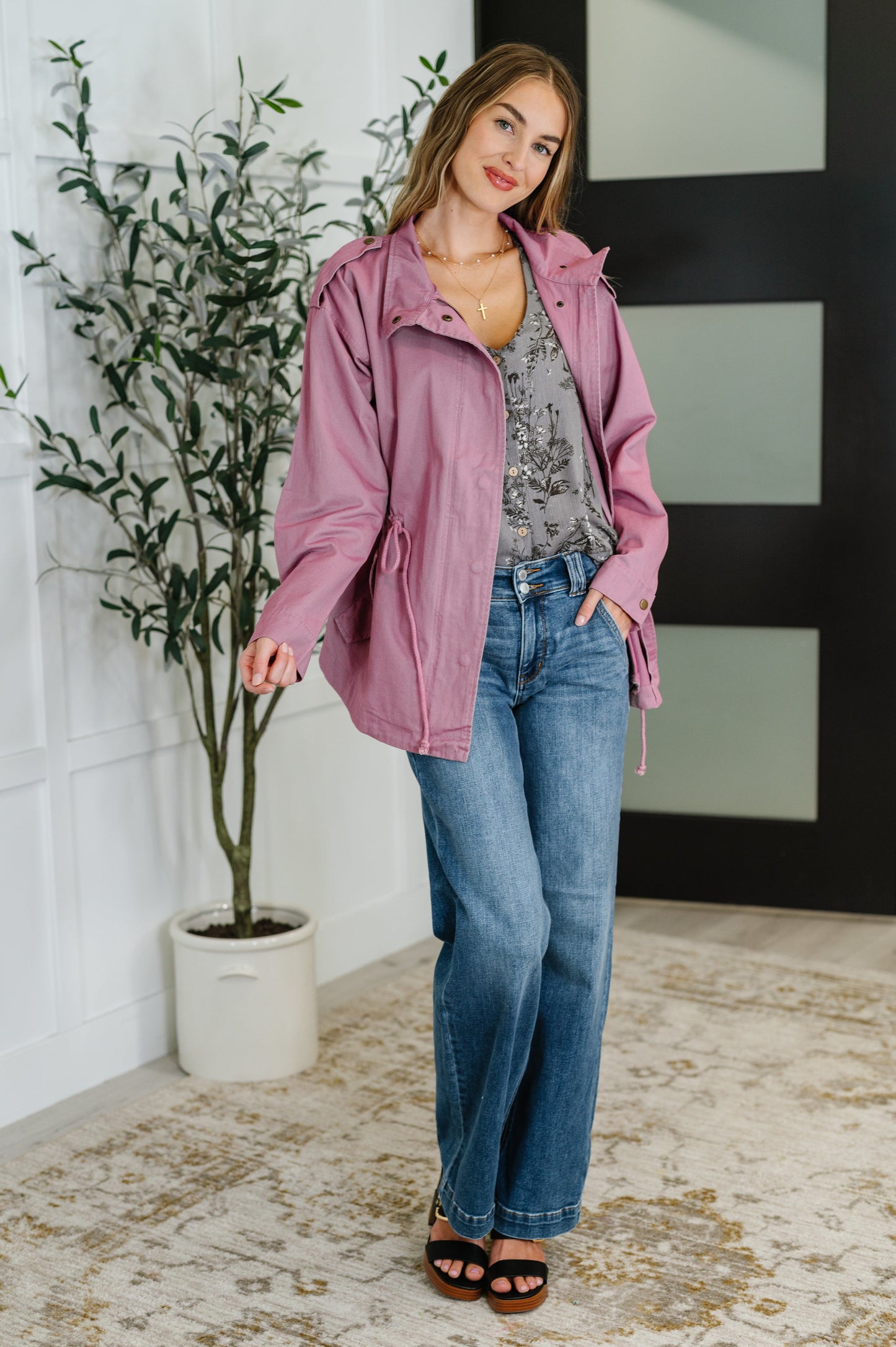 Full body view of model wearing mauve Puddle Jumper jacket