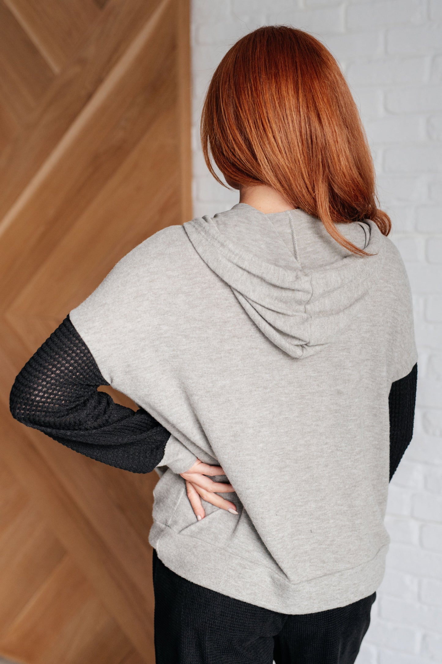 Dottie Color Block Hoodie back view in gray brushed hacci with black waffle knit sleeves and hood.
