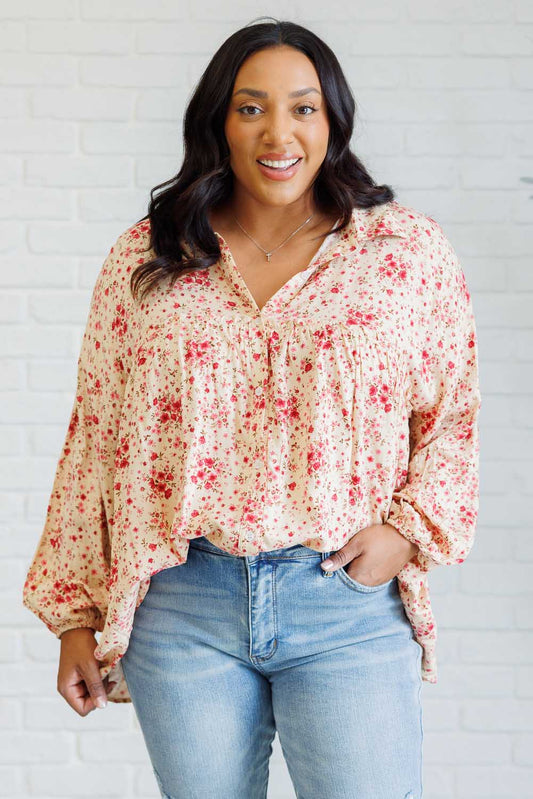 Plus size front view of Rea floral button down shirt with collared neckline and balloon sleeves.