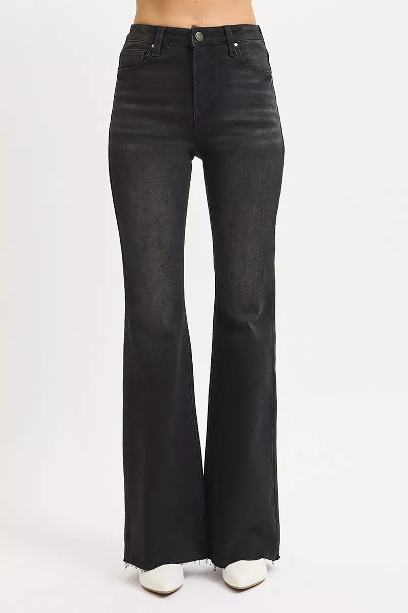 Size inclusive front view in Rhonda High Rise Flare Jeans, raw hem black denim