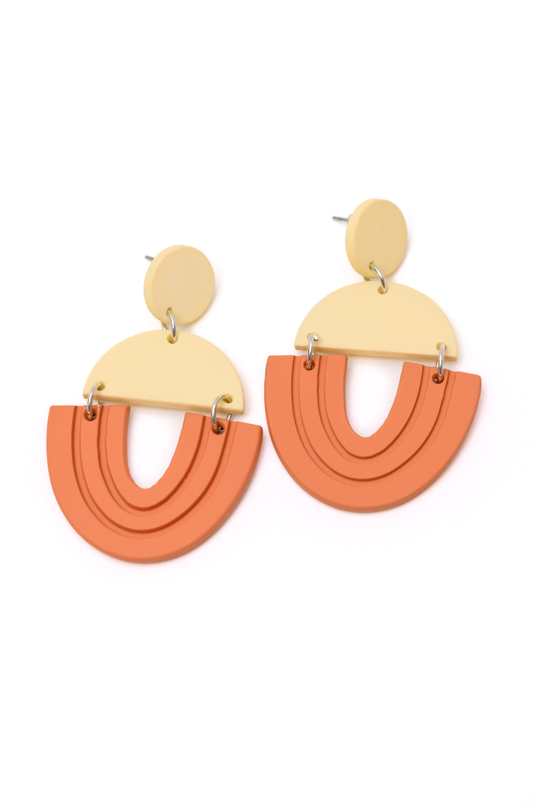 Pair of Right On Time geometric drop earrings in beige and orange with clay-inspired handcrafted look.