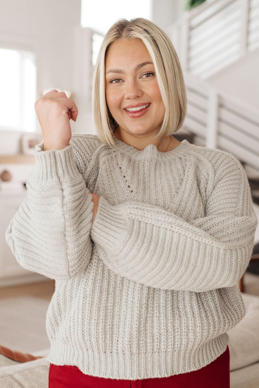 Plus size model in Hattie Balloon Sleeve Sweater showing ribbed neckline and balloon sleeves.