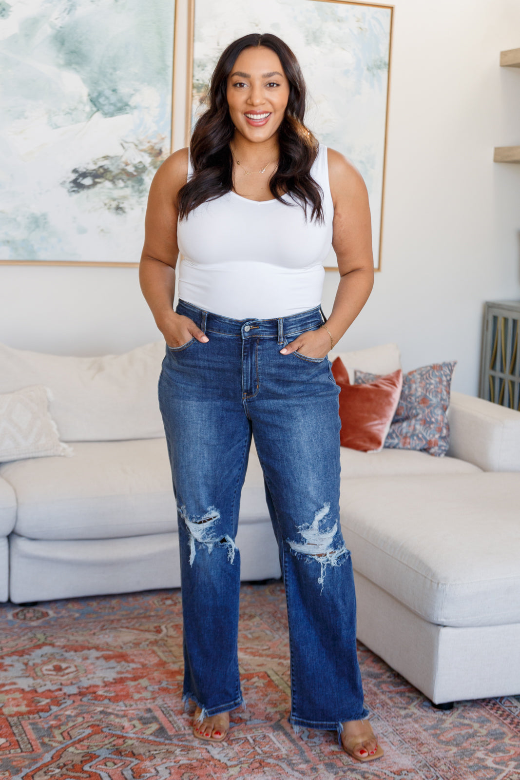 Plus size full body view of Rose High Rise 90's Straight Jeans in dark wash with straight leg and knee distressing.