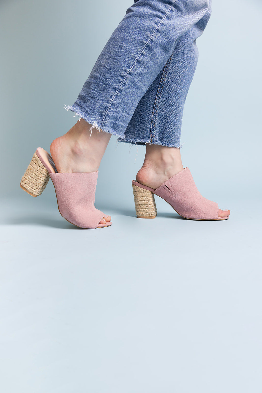 Helena Blush Suede Sandals styled on model with blush suede straps and raffia-textured block heel