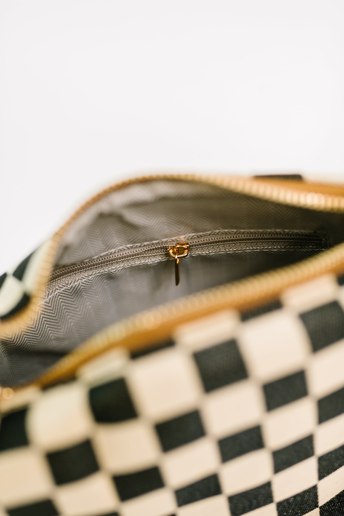 Interior of Send a Check Crossbody Bag canvas bag with zipper and pockets.