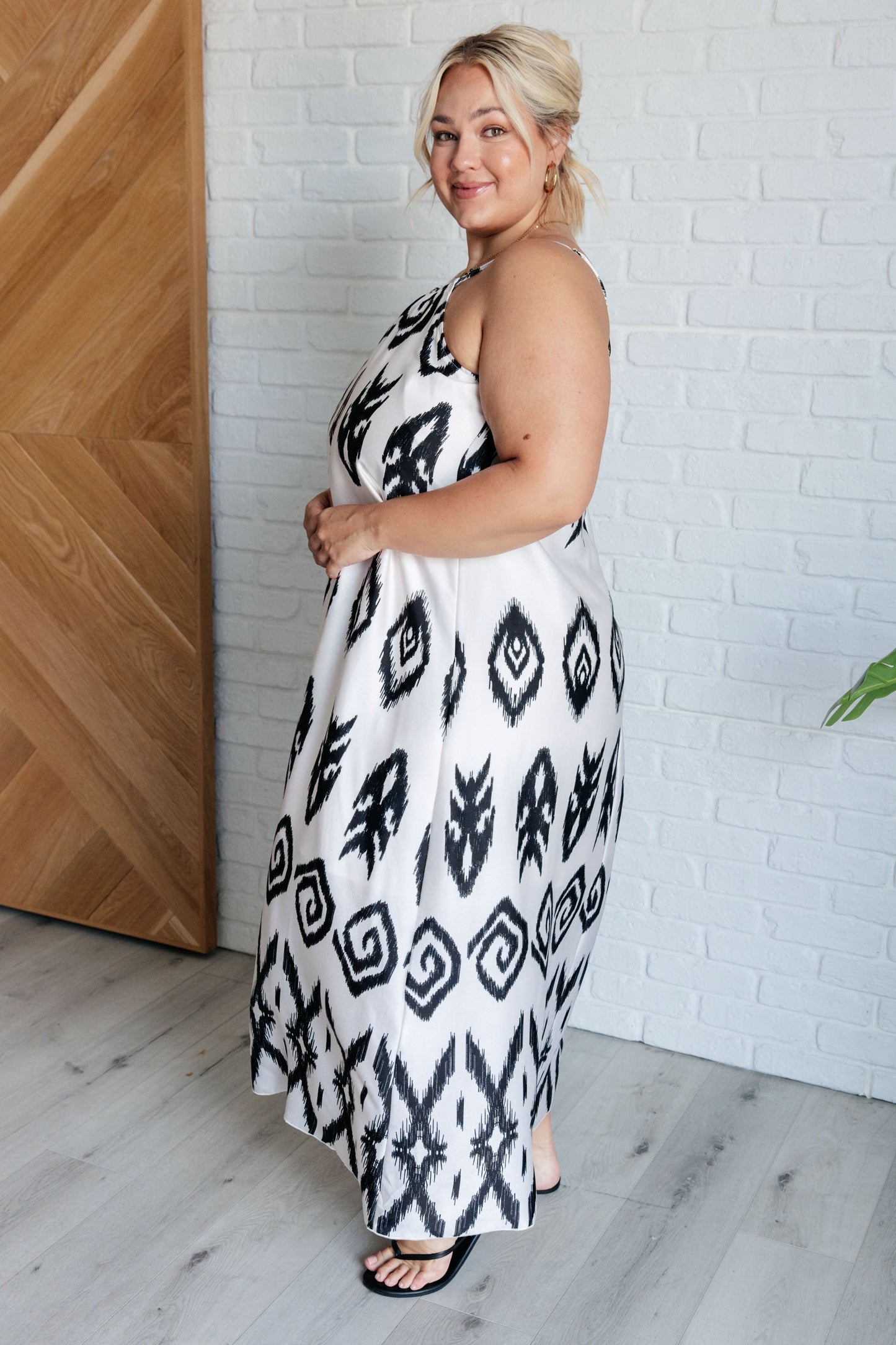 Plus size Sigrid maxi dress with geometric print, adjustable spaghetti straps, and silver hardware accents.
