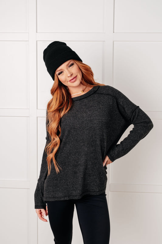 Black Simon Ribbed Hacci Sweater front view with banded neckline and drop shoulders for cozy casual wear.