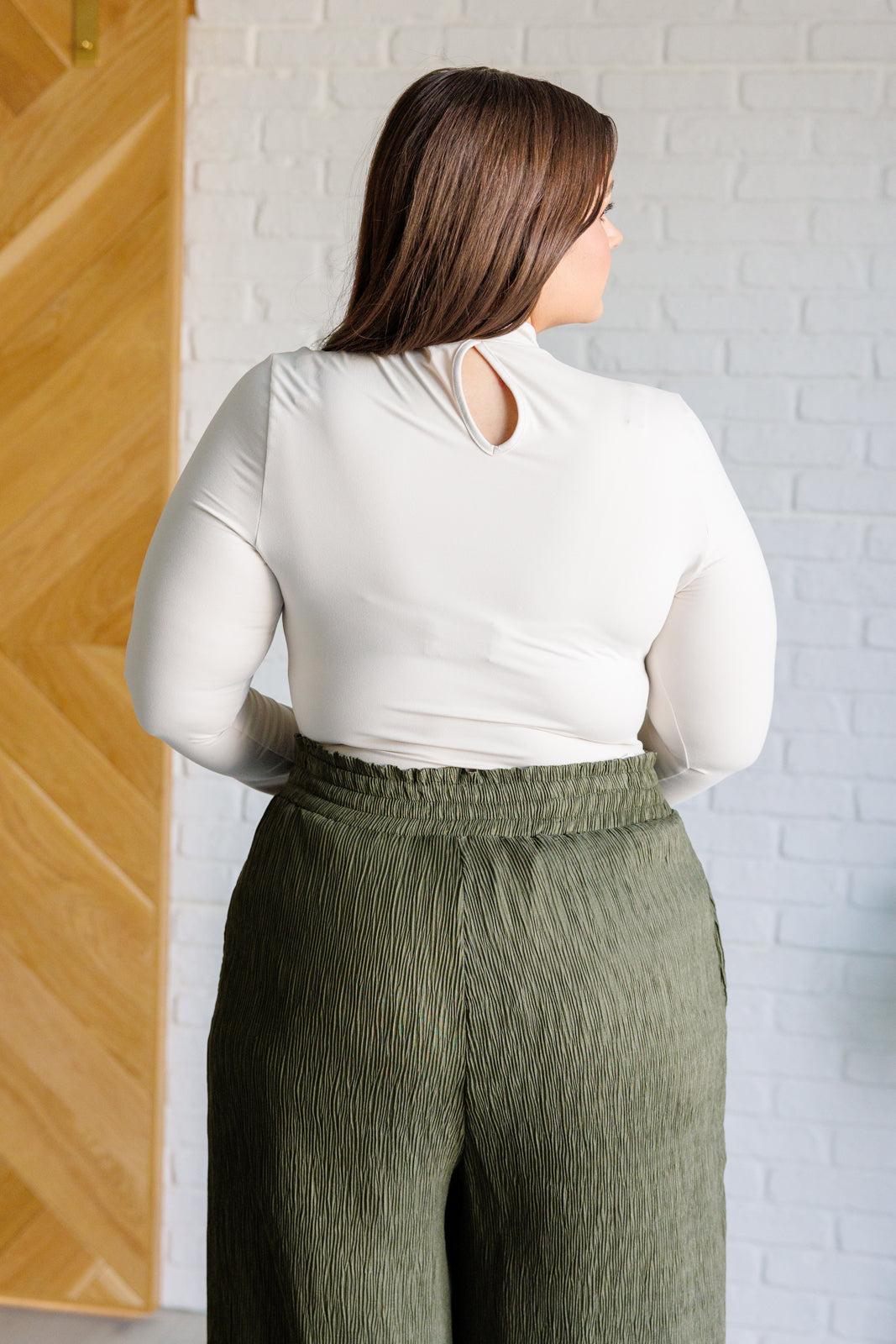 Plus size back view of Sharron Mock Neck Bodysuit in White Pearl with sleek fit and keyhole cut out.