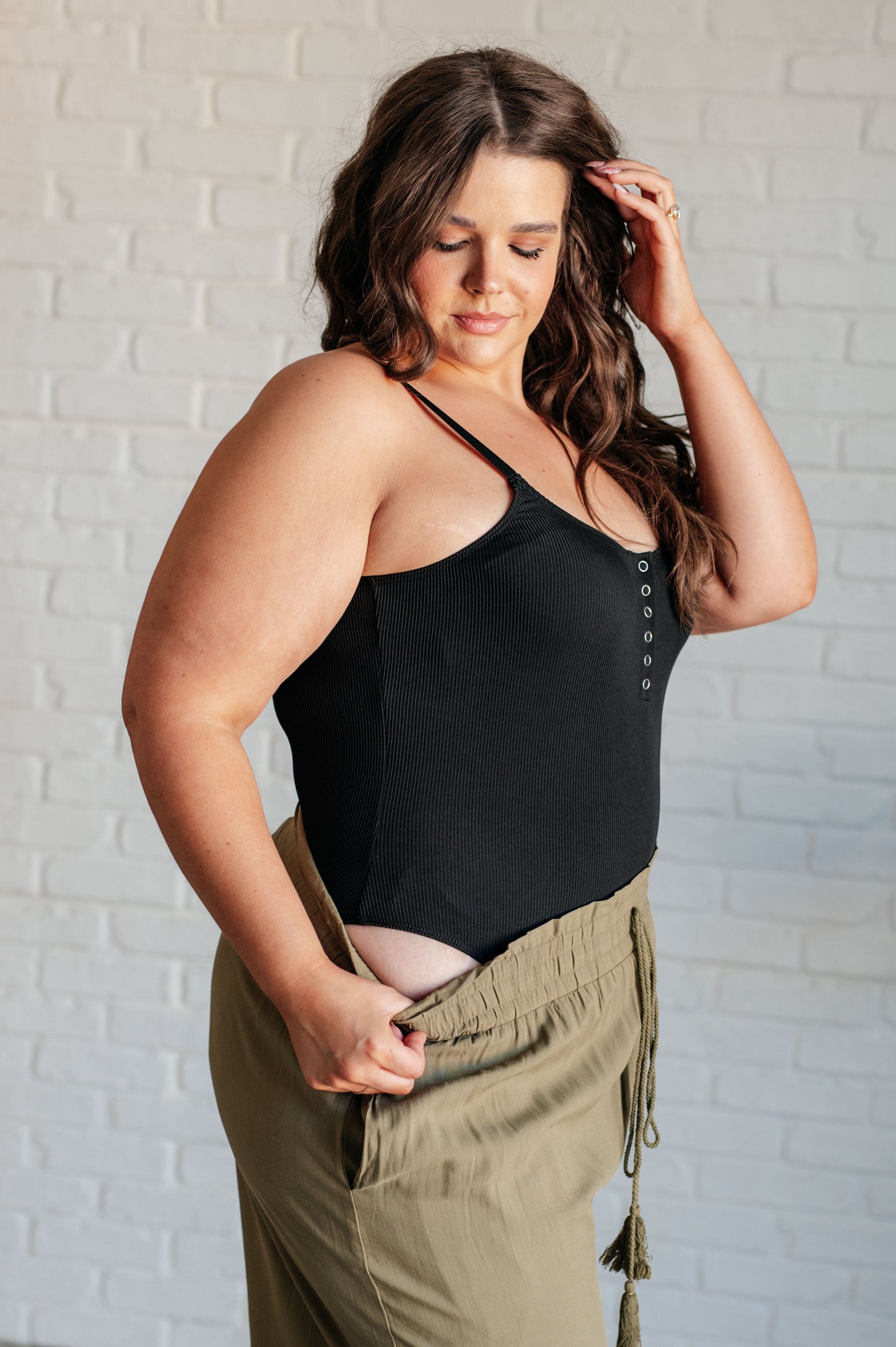 Plus size side angle of Saylor Ribbed Knit Bodysuit with cheeky thong fit and adjustable straps.