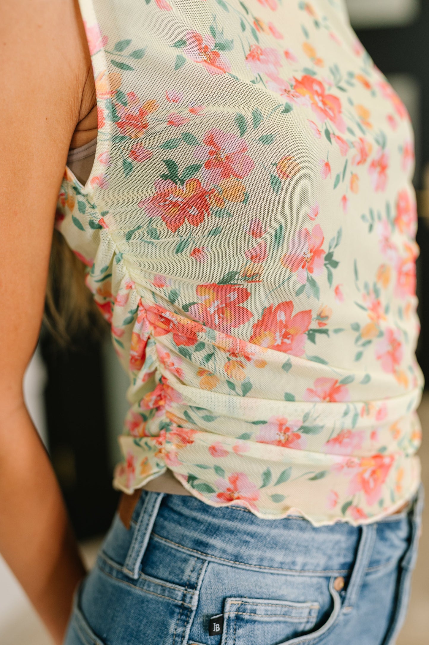 Close-up side view of the Zya sheer chartreuse tank highlighting floral mesh fabric and ruched detail.
