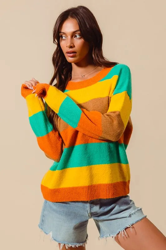 Full body model wearing Sunny Stripe Sweater with round neckline and ribbed texture, styled with casual jeans.