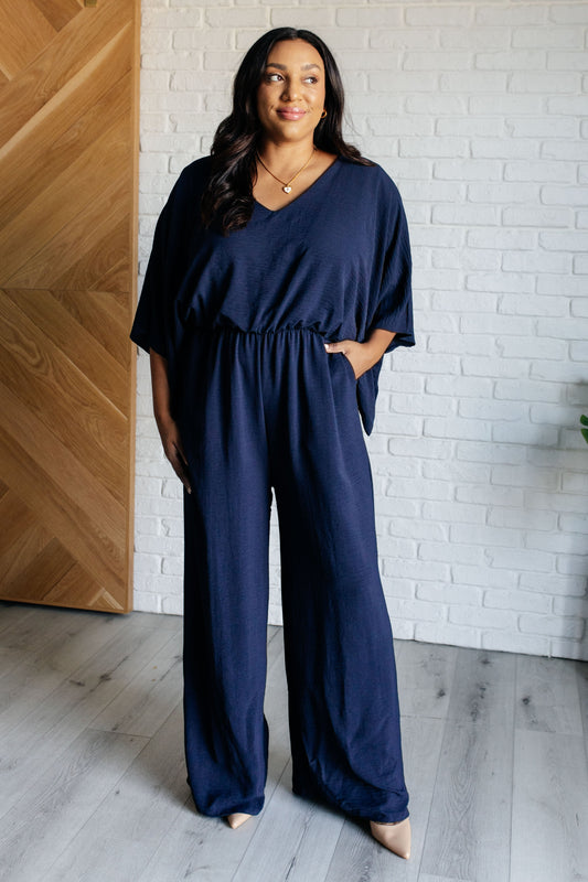Plus size Sonya Navy Wide Leg Jumpsuit styled for casual comfort with v-neckline and wide legs.