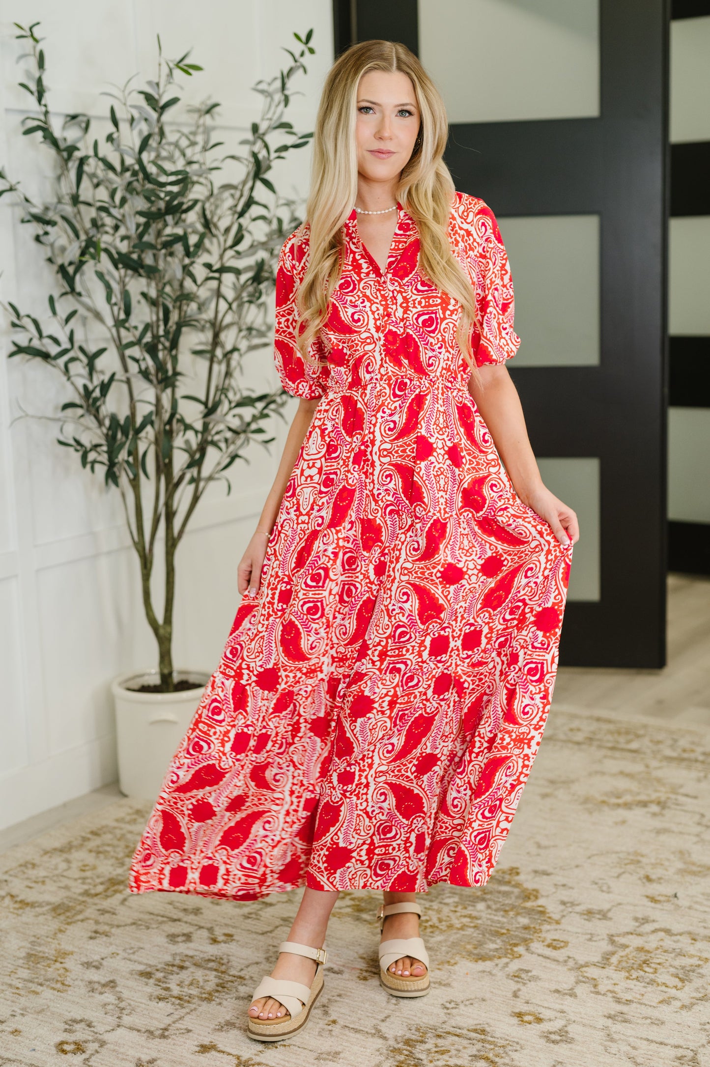 Front-facing full body view of the Jemma Red Floral Maxi Dress, paired with sandals—perfect for a summer-ready look.