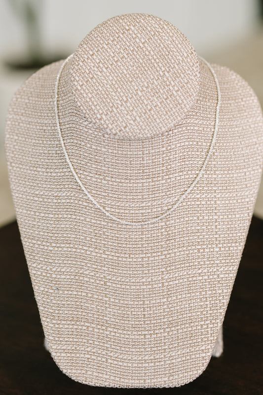 Subtle Sparkle Dainty Necklace displayed on stand, twisted 925 silver chain with subtle sparkle detail