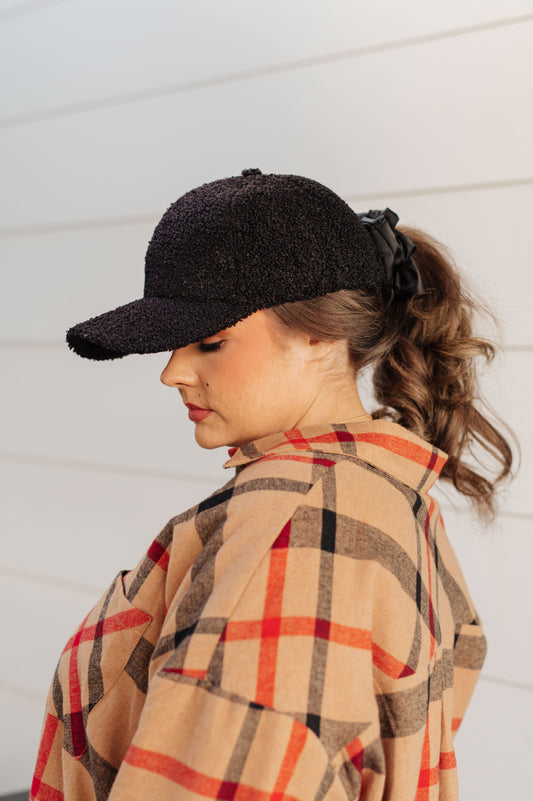 ide view of Lyla Sherpa Ball Cap in black boucle sherpa fleece with curved brim and timeless dad hat silhouette.