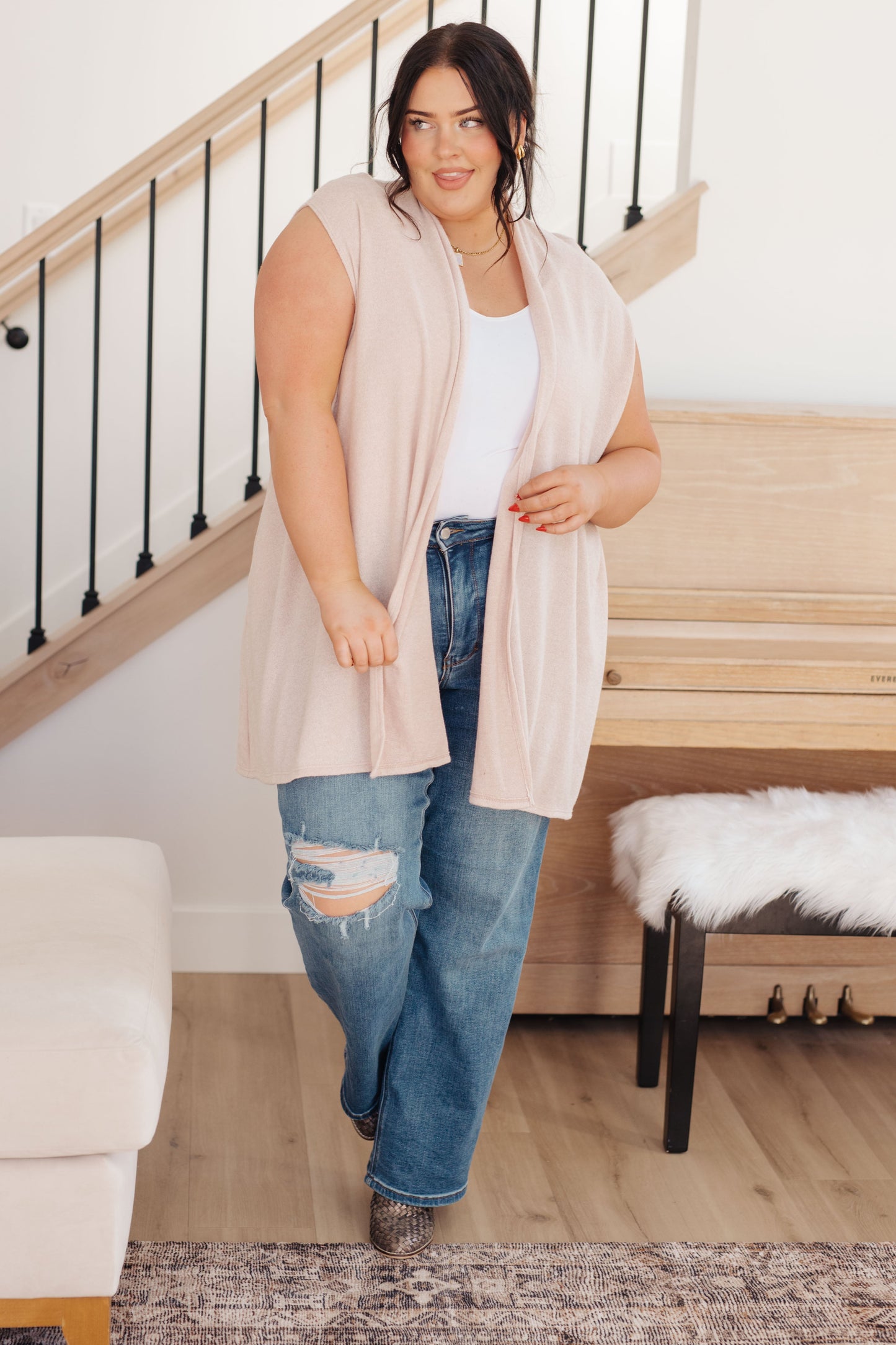 Plus size full body view of Priscilla Sleeveless Cardigan in cream with open front and practical side pockets.