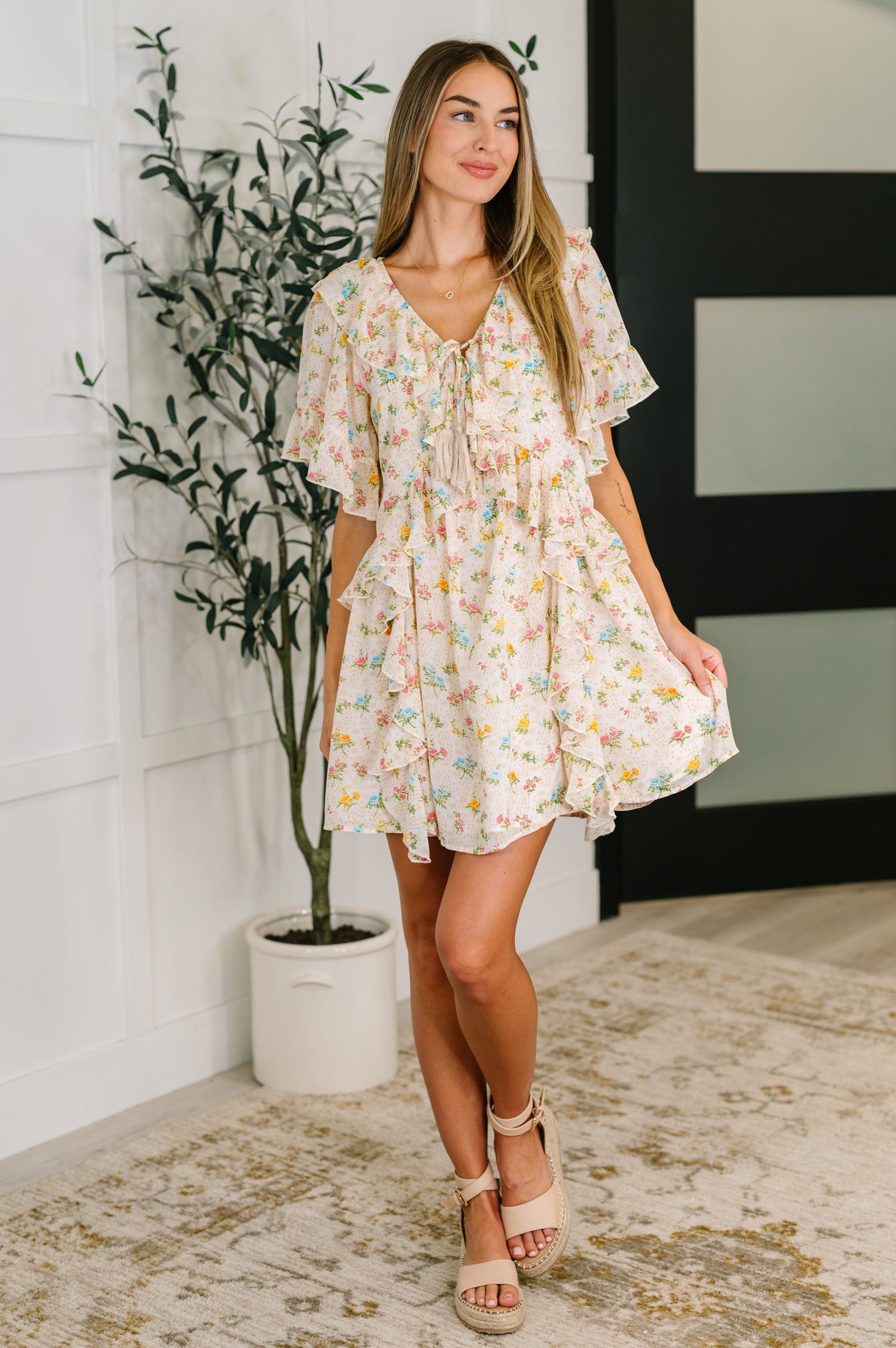 Full body view of model wearing the Addison Boho Floral Dress, styled for a breezy, bohemian summer look.