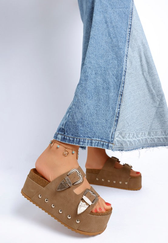 Taupe flatform slip ons with carved buckle strap and retro-inspired chunky heel back view.