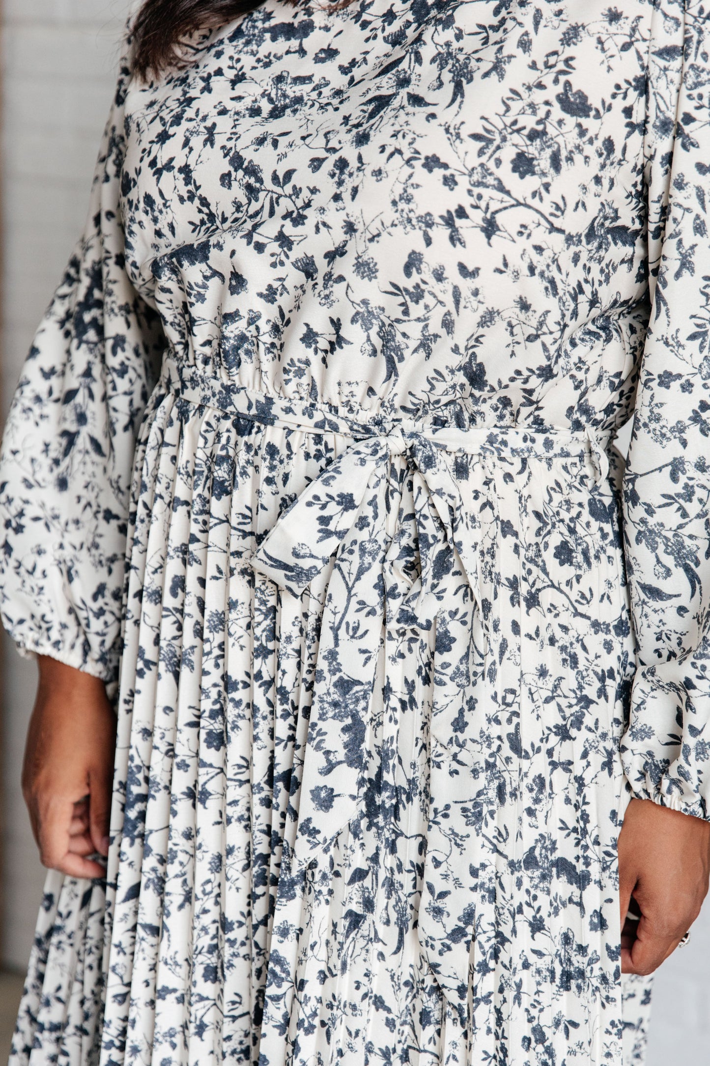 Close-up of Georgia Pleated Dress fabric showing lightweight woven pleats and soft texture.
