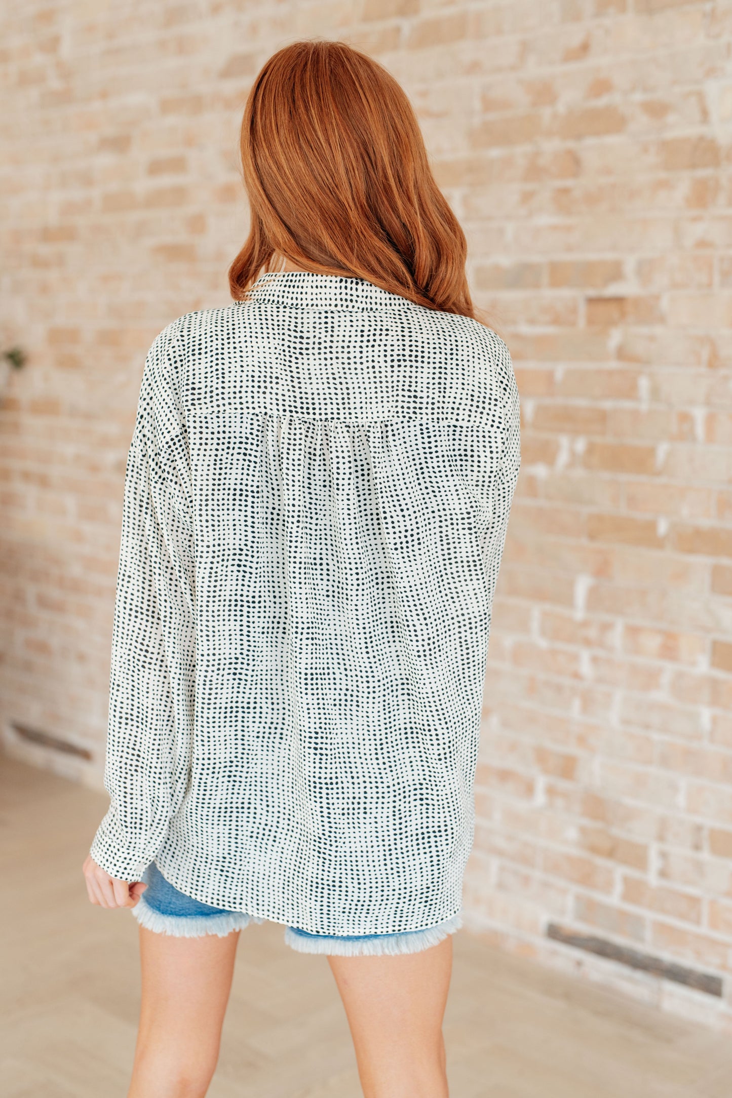 Back of Brandi Dolman Sleeve Button Up, satin patterned fabric with relaxed dolman fit