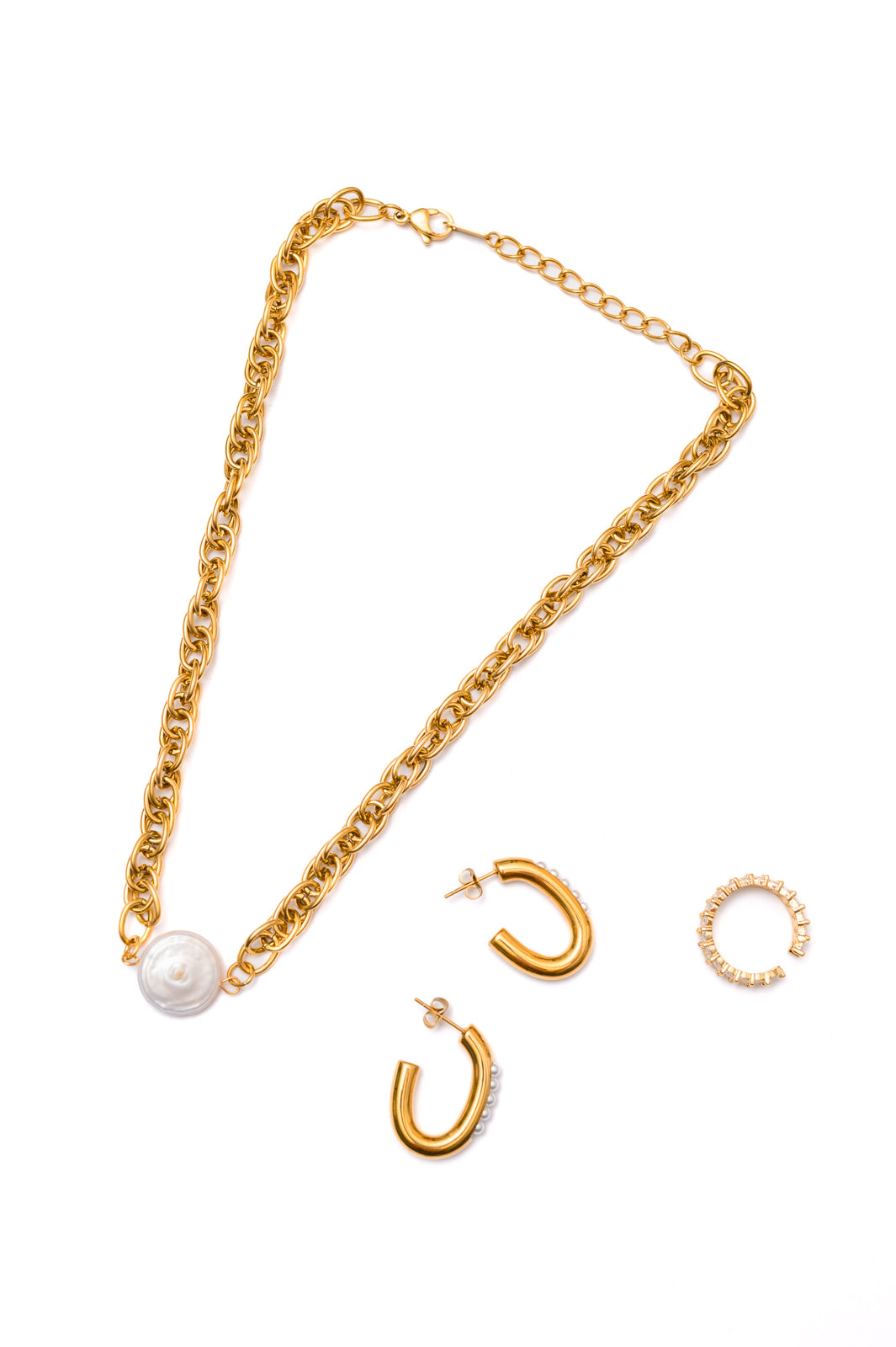 Display of Finest of Fine Jewelry Bundle showing all three pieces—ring, earrings, and necklace—on neutral background.
