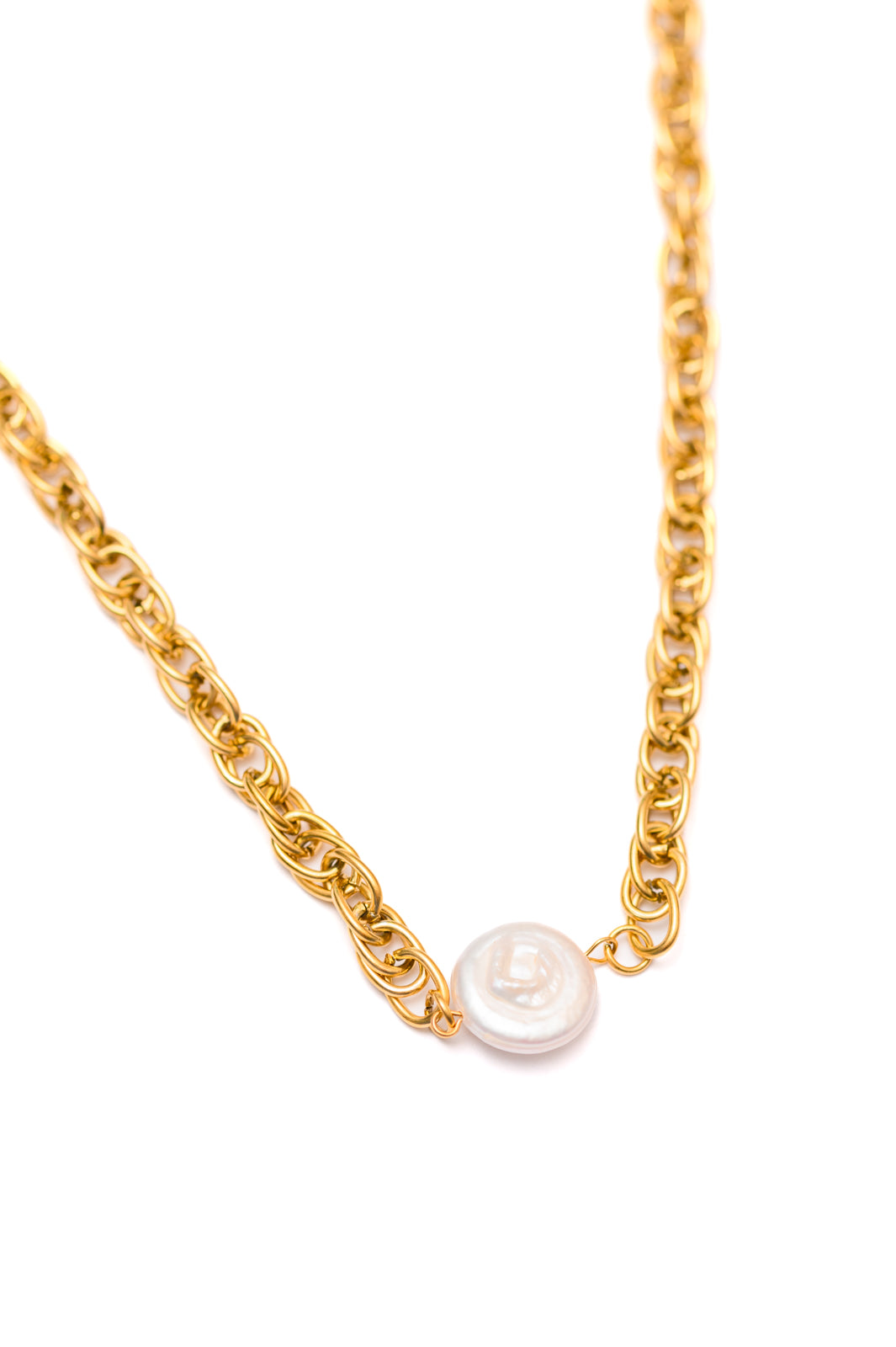 Close-up of Ocean’s Gold Shell Pendant Necklace with baroque pearl charm and gold chain.