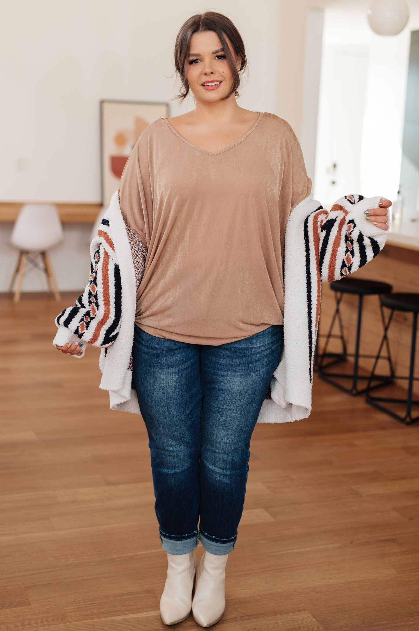 Plus-size Alessandra V-Neck Top styled with denim, relaxed fit and flowy sleeves.