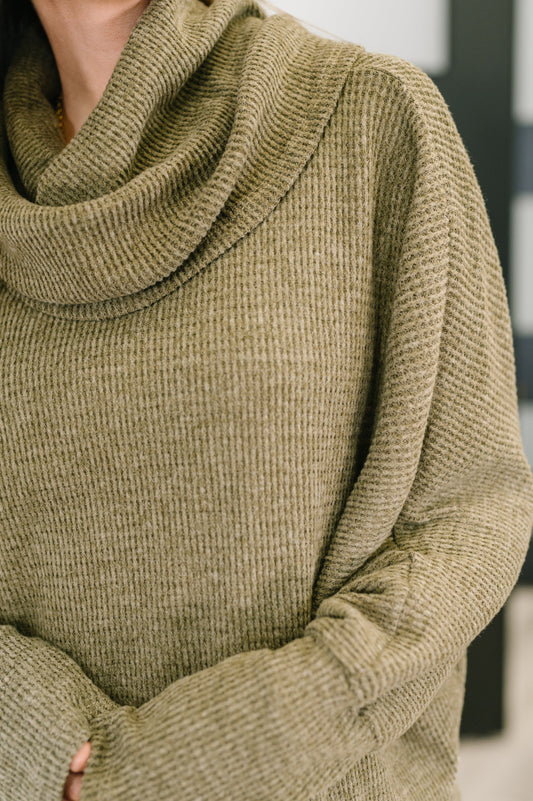 Close-up of Wannetta Set in Olive showing ribbed cuffs and waffle knit detail.