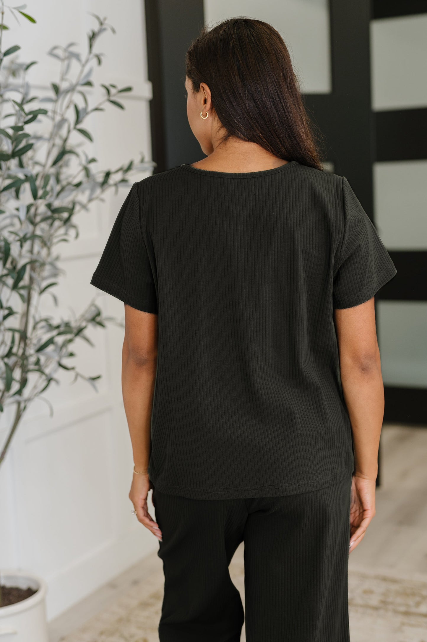 Thyme Boxy Tee in Black back view highlighting ribbed fabric and relaxed silhouette