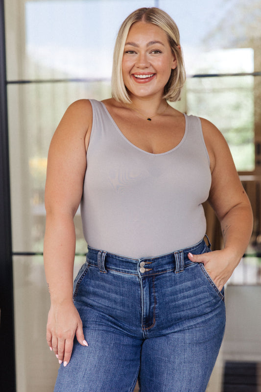 Plus size model wearing Tony Basic Bodysuit in Gray fitted seamless bodysuit.