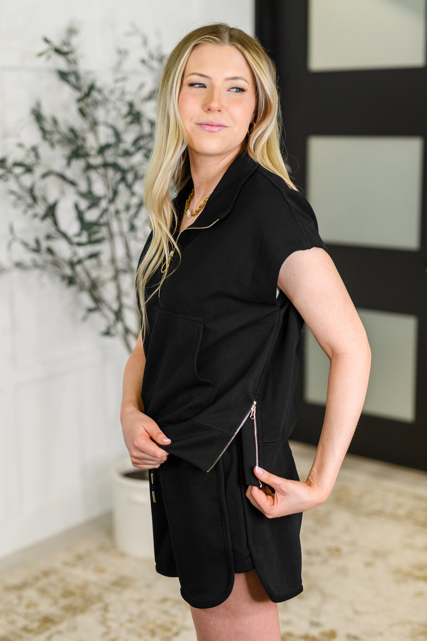 Side view of the Valery set showcasing the relaxed fit, side zipper detail on the top, and the flattering silhouette of the shorts.