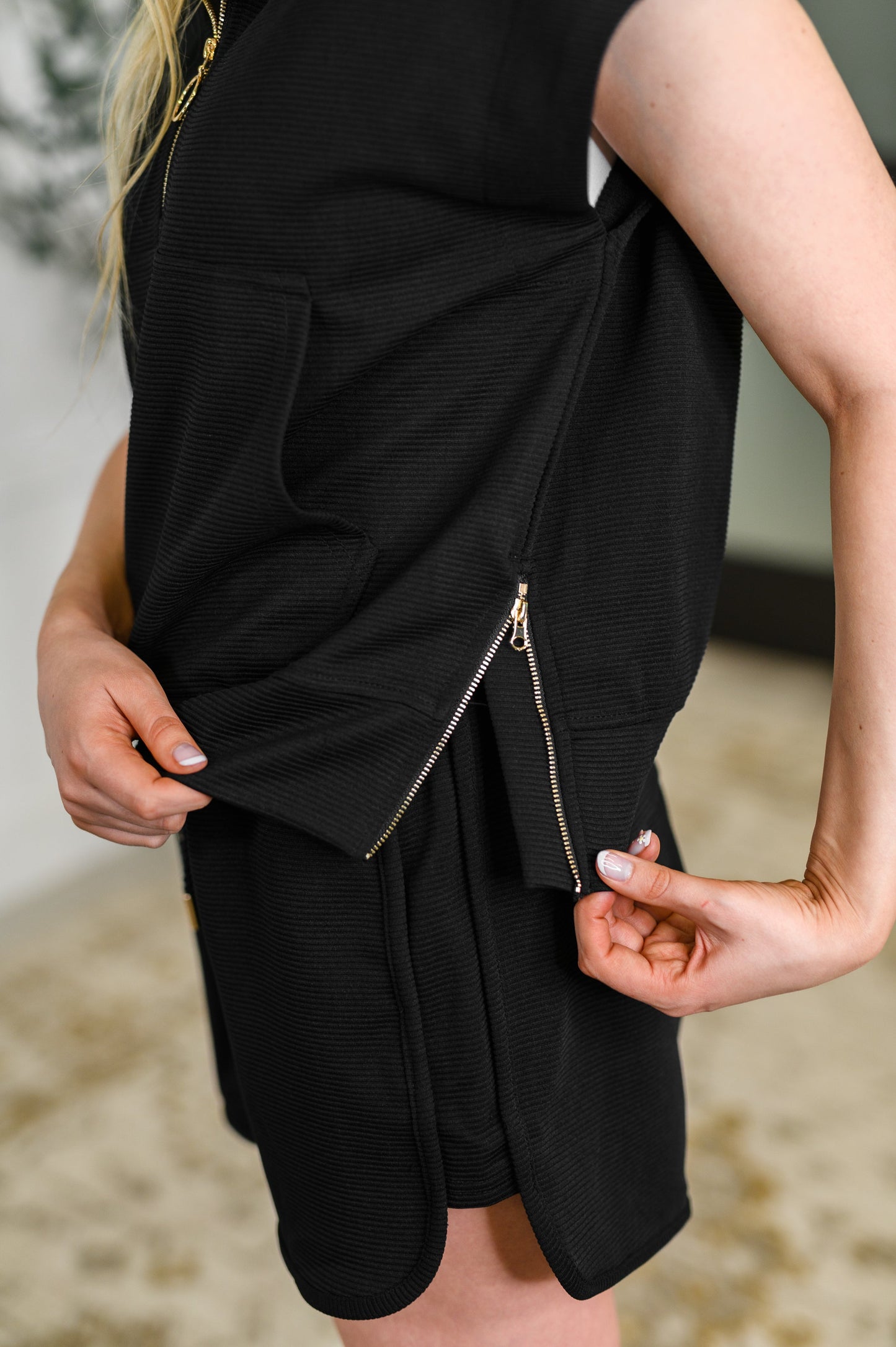 Side close-up of top and shorts highlighting bottom side zipper on top, ribbed texture, and comfy fit of both pieces.