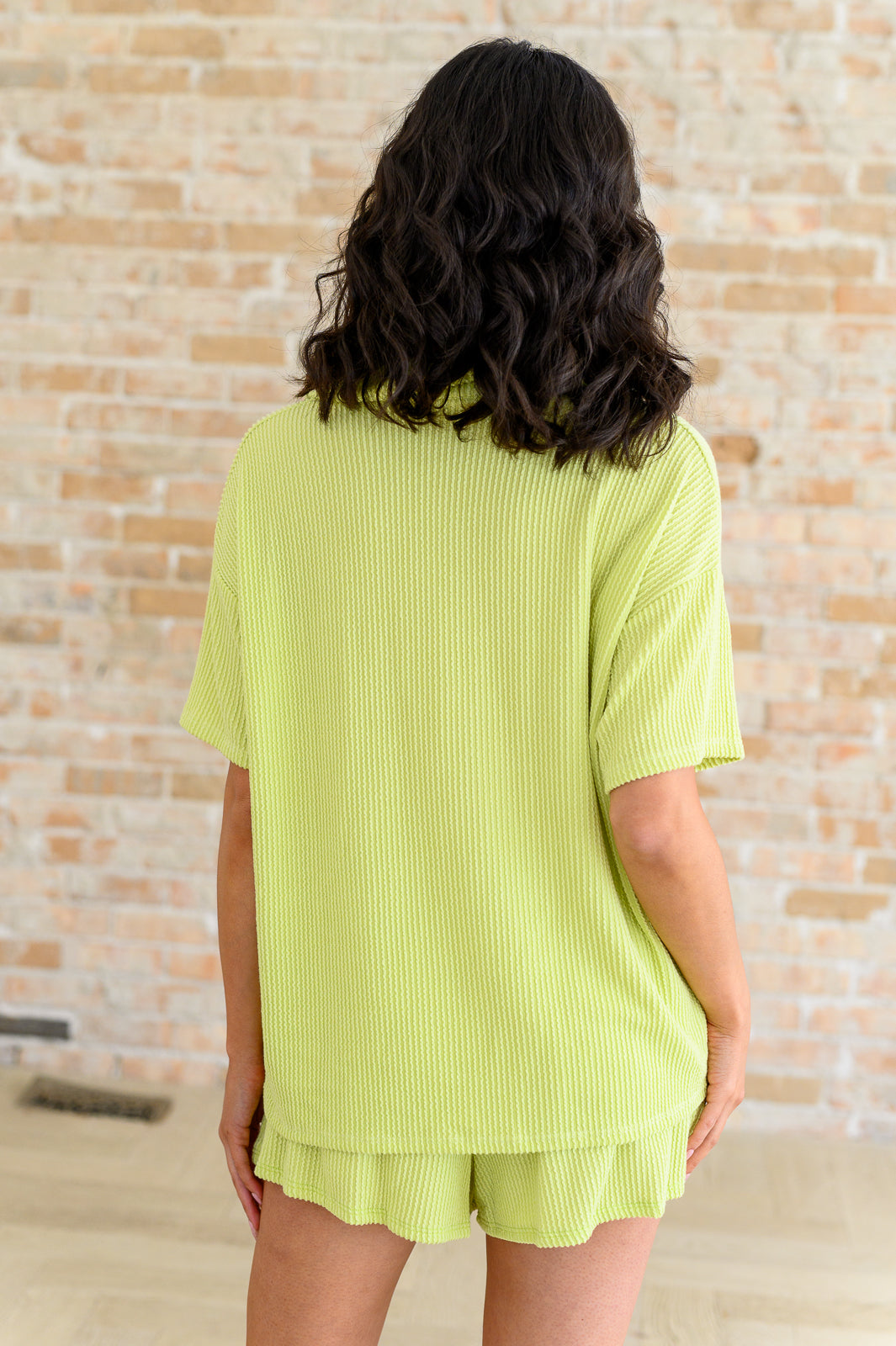Back view of Townes Ribbed Button Down Shirt with matching shorts set, textured knit in pear green