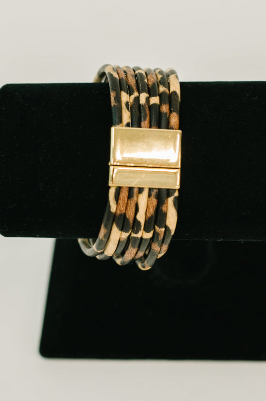 Front view of Untamed Edge Chunky Bracelet with leopard print pleather and gold hardware.