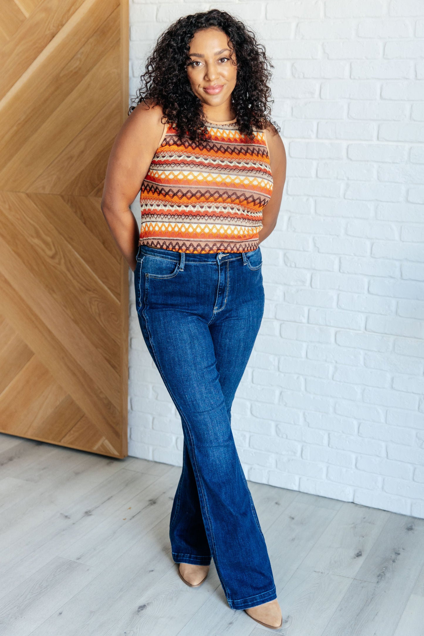 Stylish plus size multicolor geometric knit tank, designed with a round neckline and a slight crop cut.