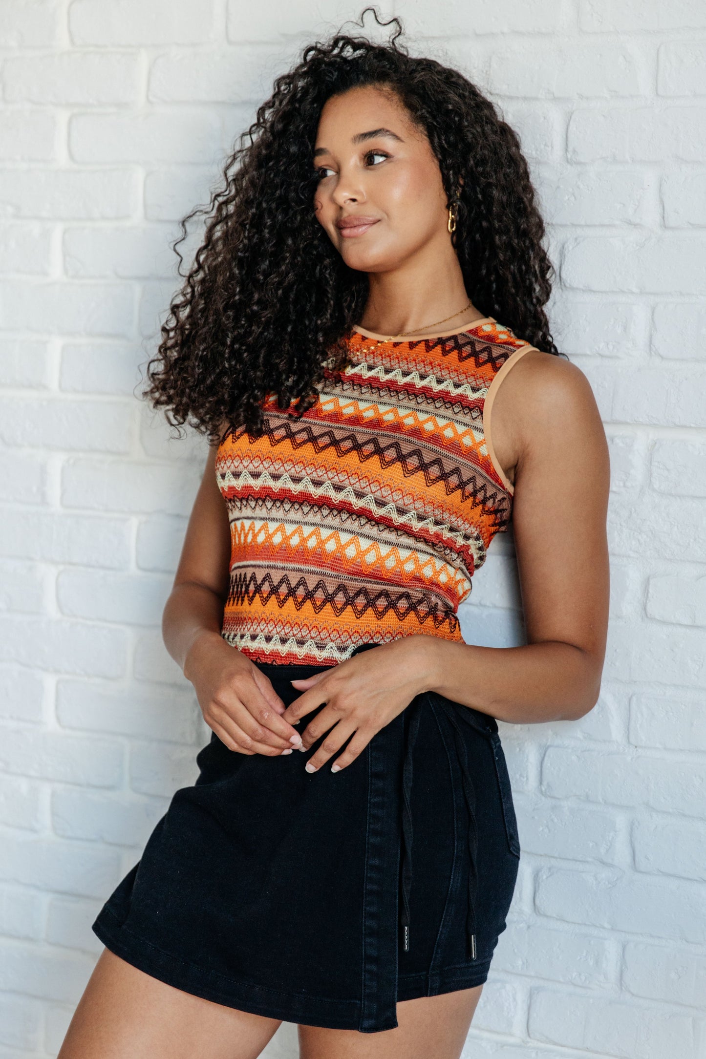 Ulani high-stretch knit tank with a colorful geometric design and round neckline.