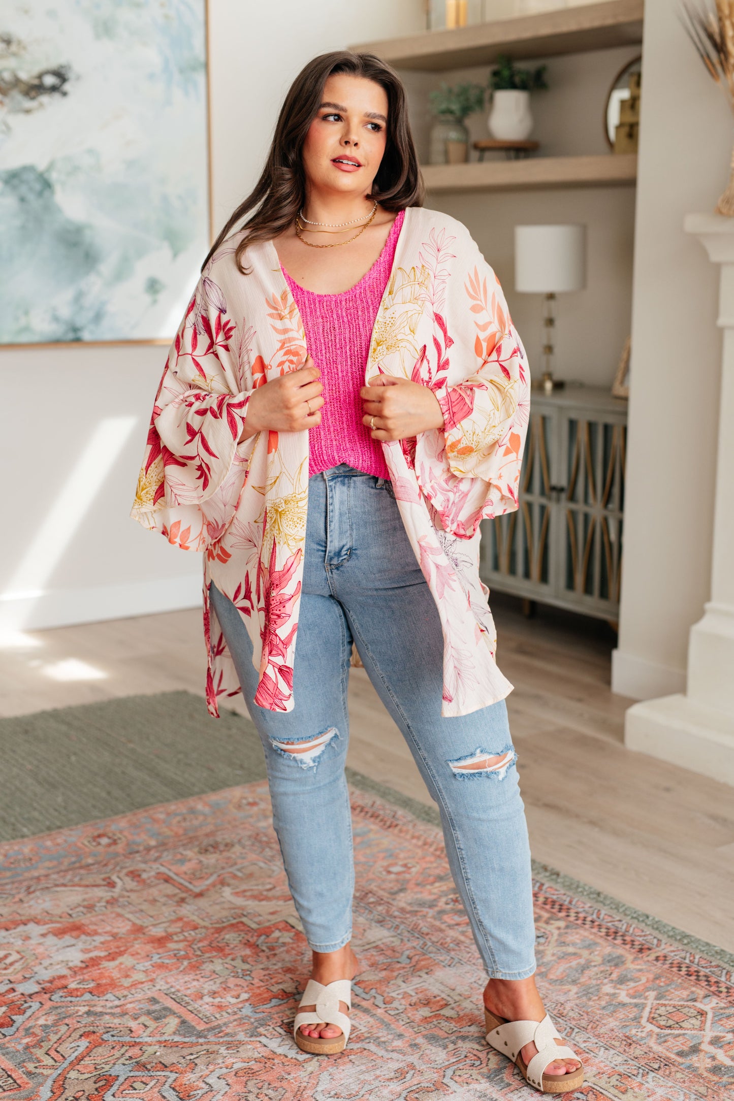 Plus size model styling Mei Bell Sleeve Kimono with tank, jeans, and sandals for a boho summer look.