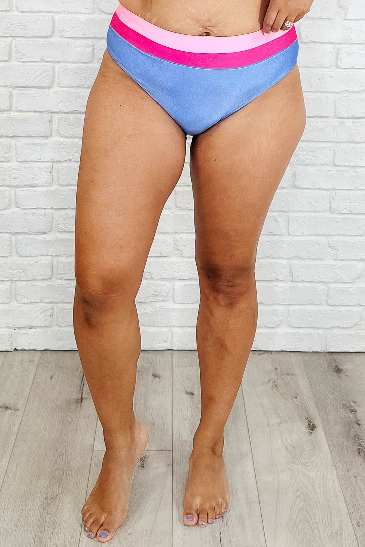 High-Waisted Swim Bottoms in blue and pink featuring a cheeky fit, banded waistband, and fully lined design for a stylish beach look.