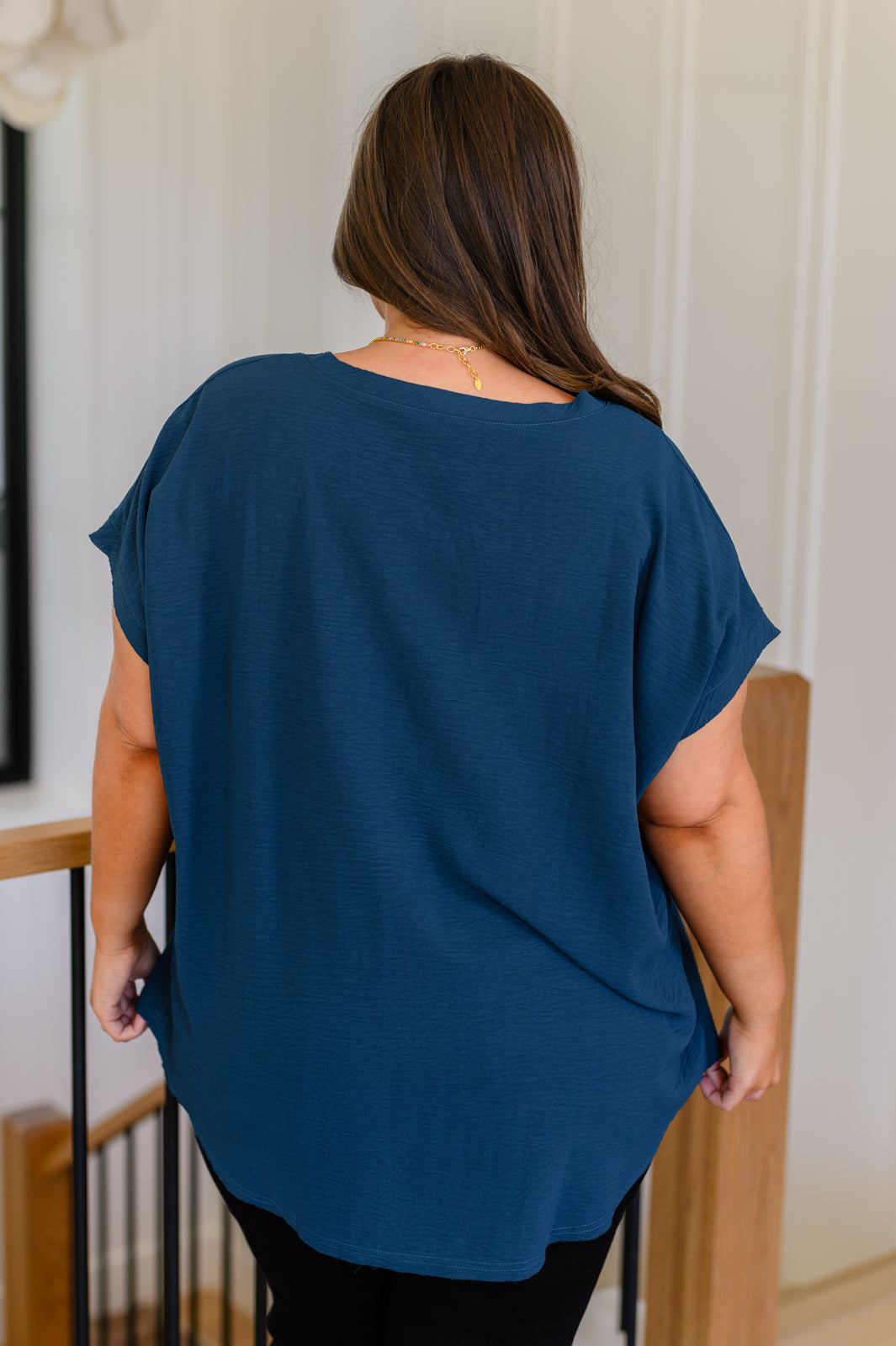 Plus size back view of Vienna V-Neck Top highlighting relaxed silhouette and textured fabric.