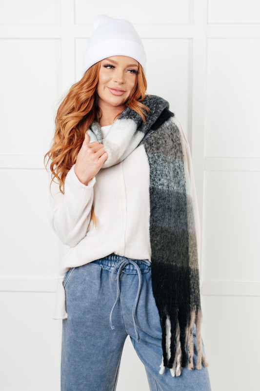 Front view of Wanderlust Wrap Oversized Plaid Fringe Scarf with brushed plaid texture.