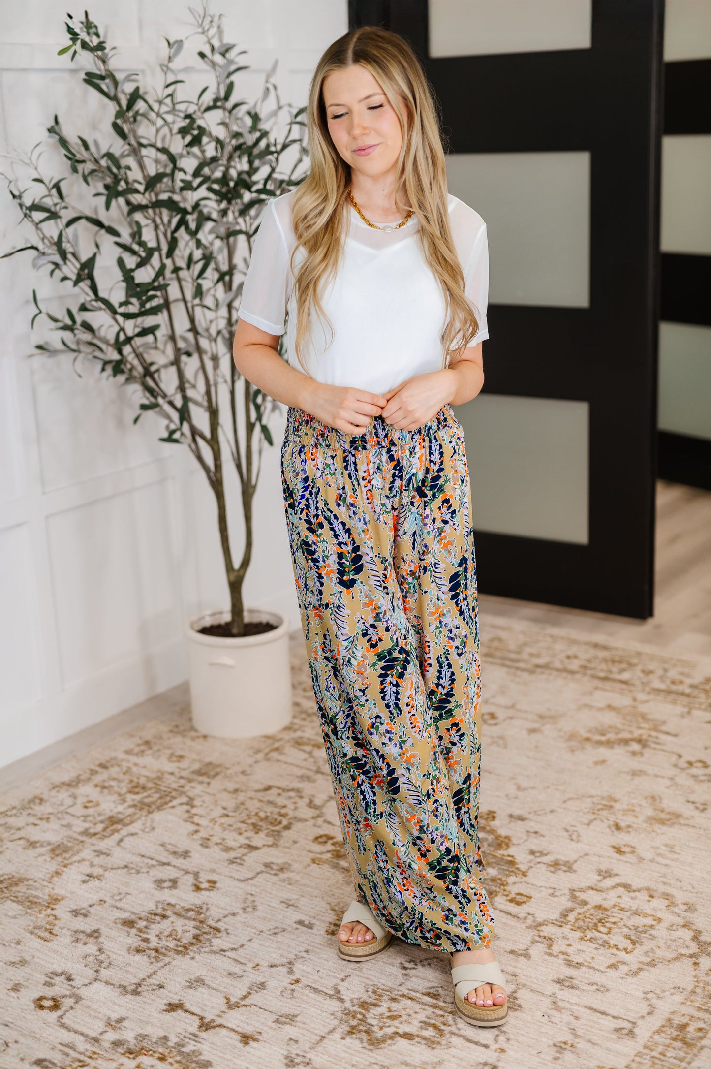 Full body view of Marisol Layered Mesh Top styled with flowy floral boho pants.