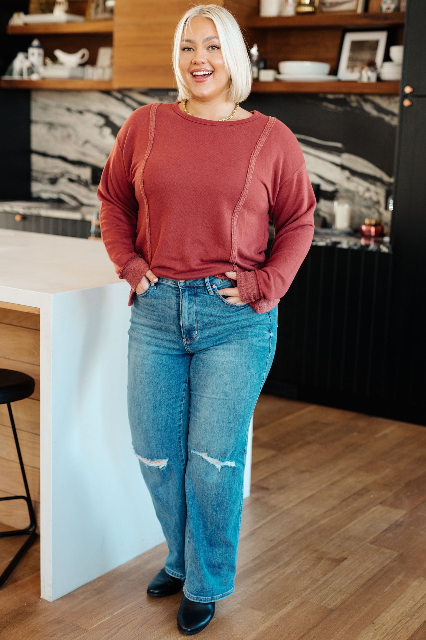 Plus size full body view of red Taya Pullover with flattering dropped shoulder fit and stepped hemline.