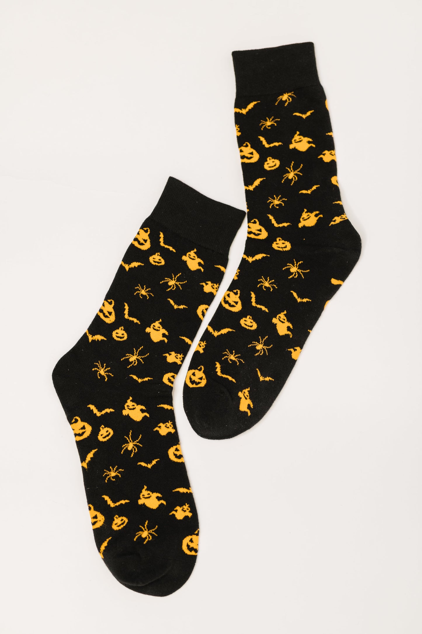 Flat lay of Wicked Walk Quarter Socks showing full Halloween-inspired pattern