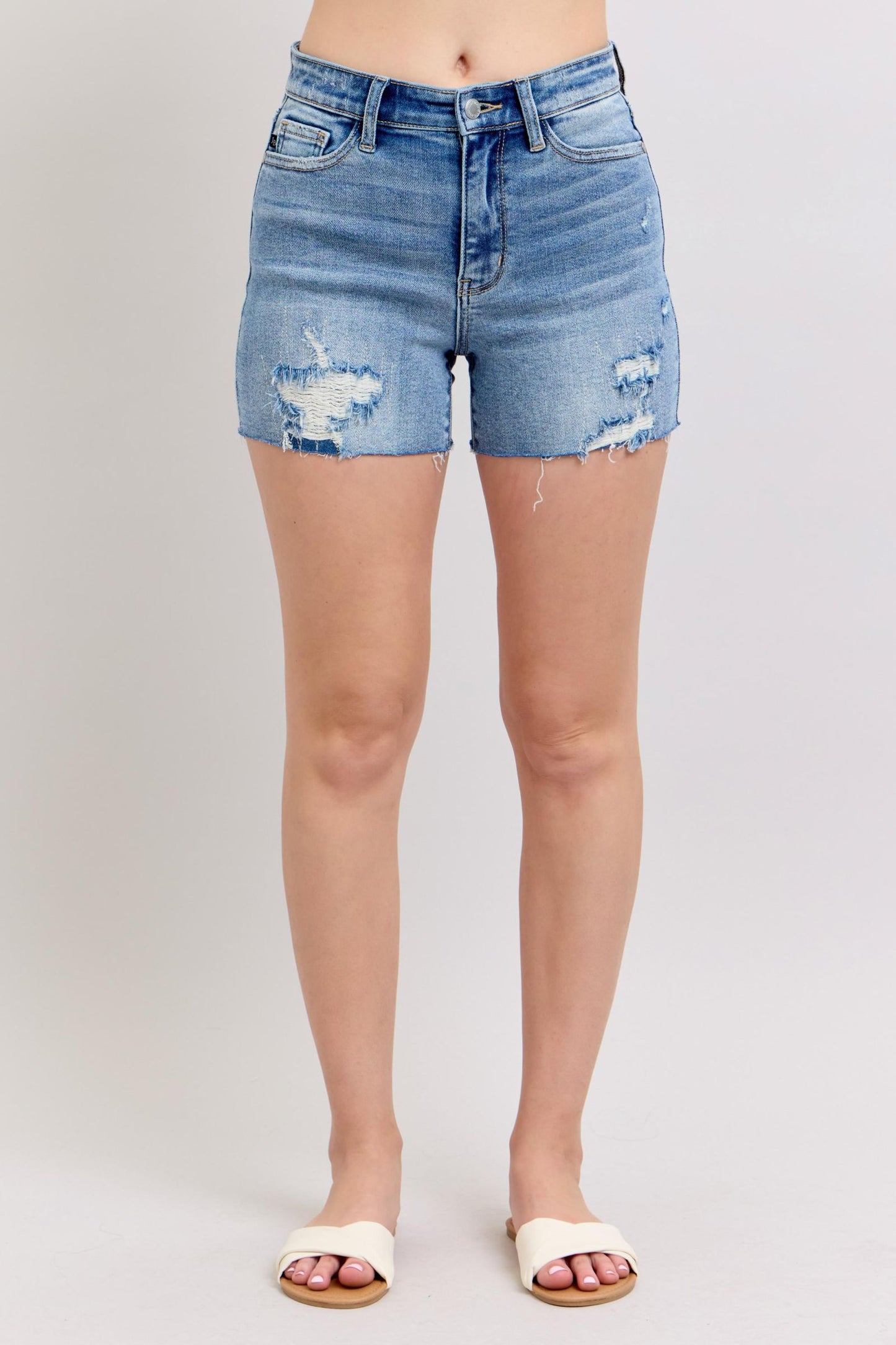 Women's Judy Blue high rise raw hem shorts with stitched distressed panel detail.