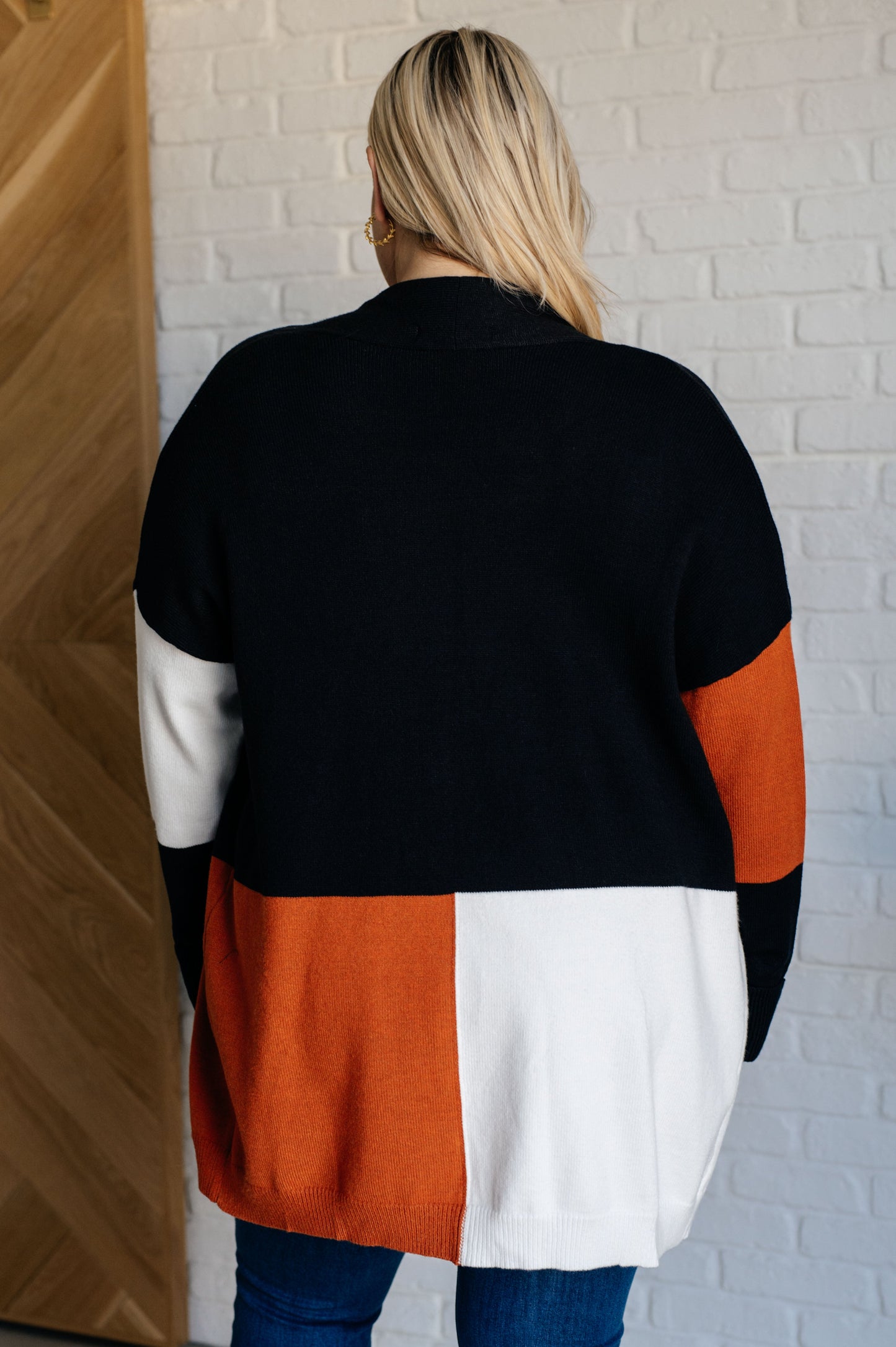 Plus size model showing back of Jackie color block cardigan