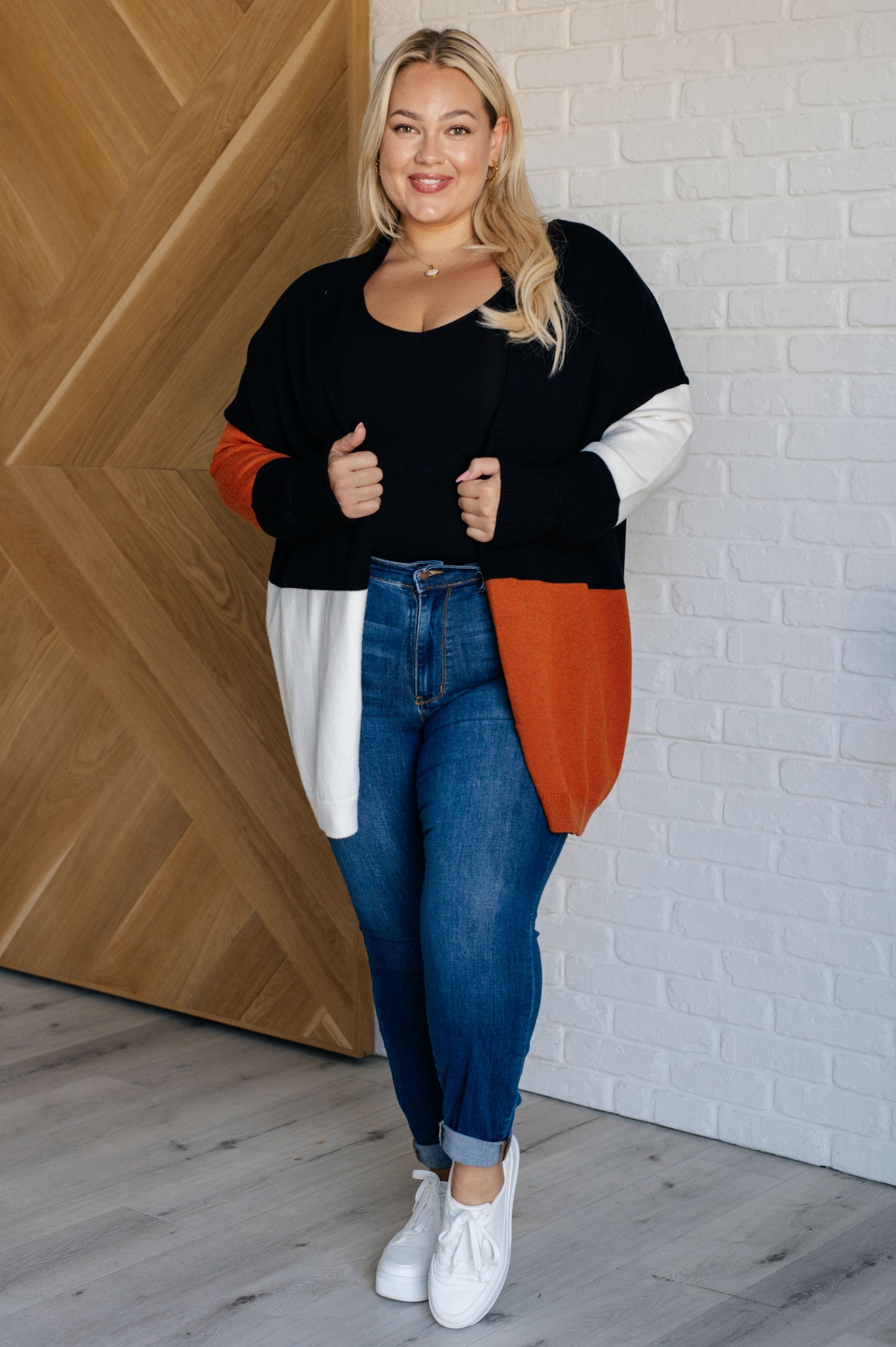 Plus size model wearing Jackie color block cardigan full body view