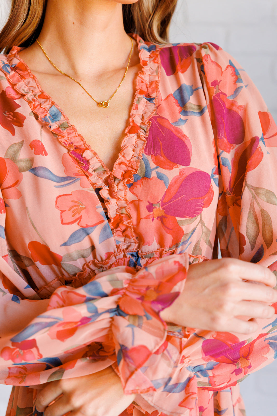 Close-up of long sleeves on Maci Floral Midi Dress with floral chiffon fabric and elastic cuff detail