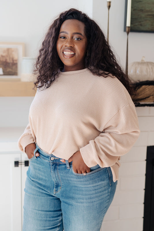 Plus size model in Holly Pullover showing cozy ribbed knit and dropped shoulders.