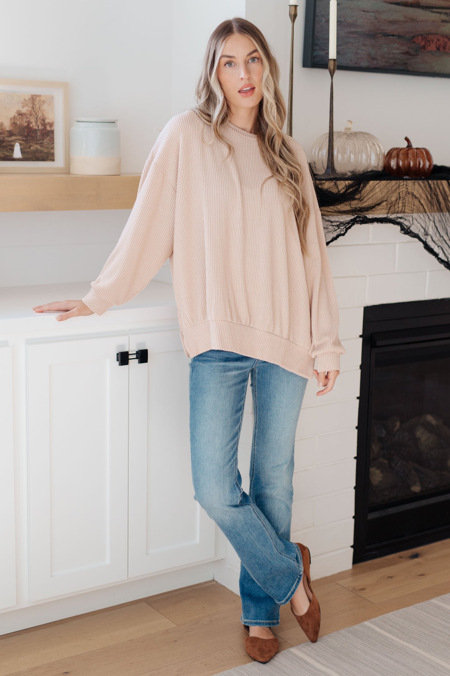 Model styled in Holly Pullover with jeans for a casual fall look.