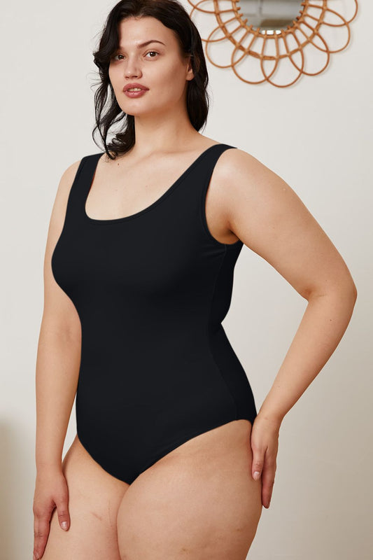Plus size model in Sarah Black Square Neck Bodysuit with flattering fitted design.